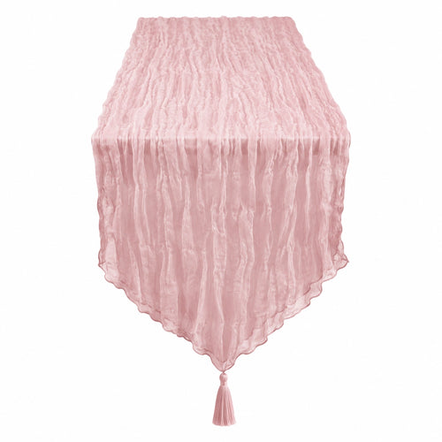 Chemin de table rose clair avec texture froissée et pompons